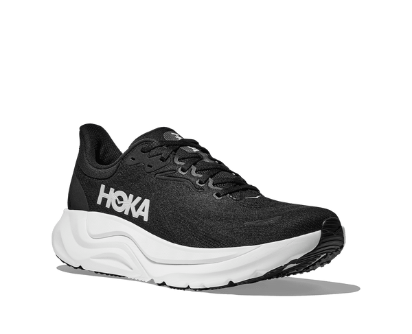 Hoka is stitched onto the lateral side of the upper using white thread. 
