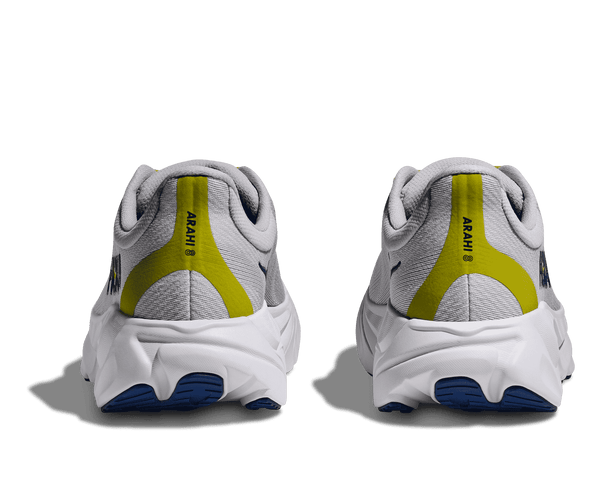 Arahi 8 is printed on the back of the shoe upper over a chartreuse band curing around the heel. 