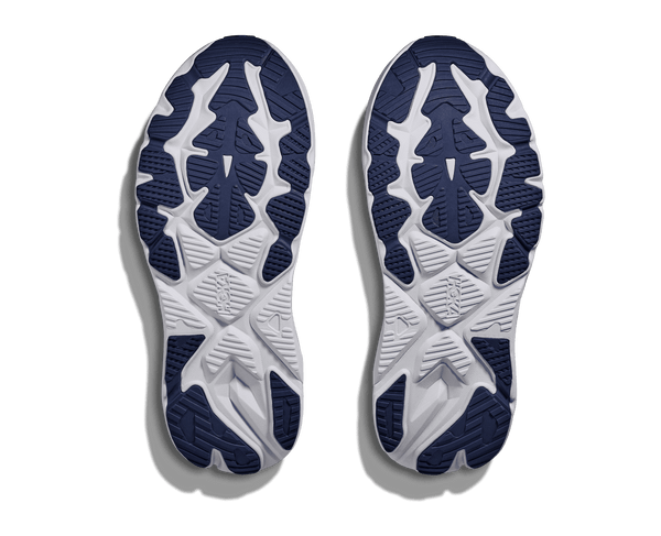 Navy blue rubber is used on the outsole of the shoe to contrast the white midsole. 