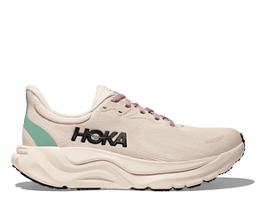 White running shoe with 'Hoka' branding on a transparent background