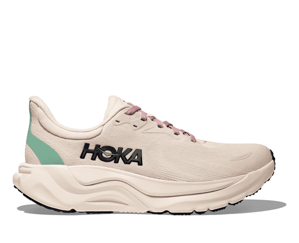 White running shoe with 'Hoka' branding on a transparent background