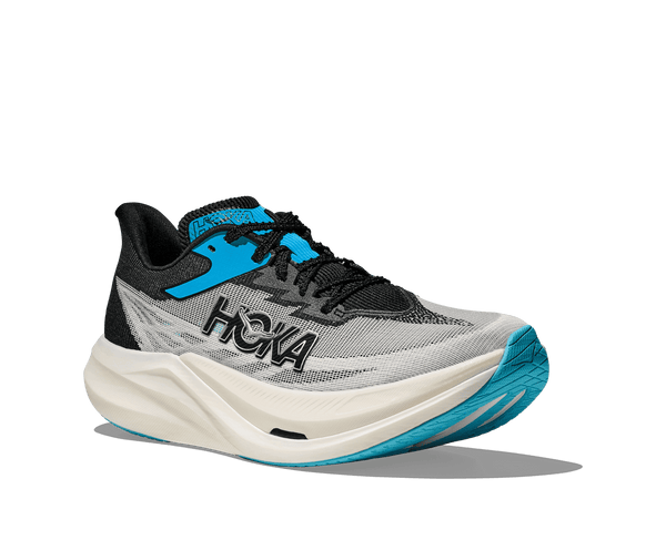 The toe of the upper going back to the ankle is grey white the tongue and heel of the upper is black. The top of the tongue has sky blue accents. 