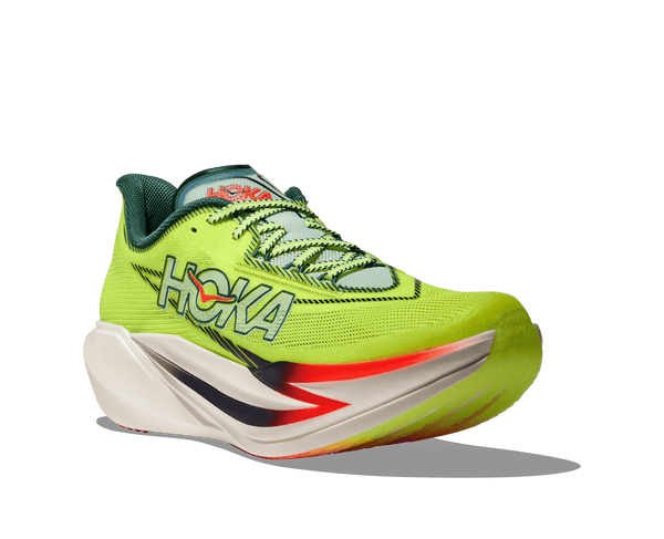 Green running shoe with red accents on a transparent background