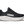 Black running shoe with white sole on a transparent background