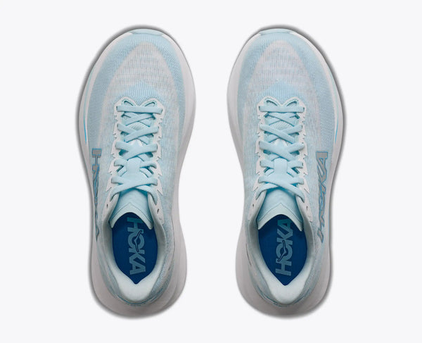 A pair of Hoka running shoes in light blue and white, shown from a top-down view on a plain white background.