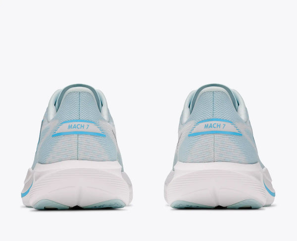 A pair of light blue and white running shoes shown from the rear, featuring a white sole and 'MACH 7' text on the heel, set against a plain white background.