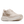 Cream colored running shoe on a white background