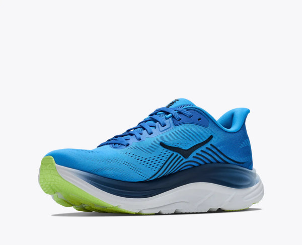 Blue running shoe with green sole on a white background