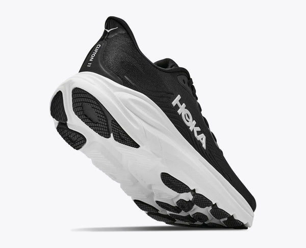 Black running shoe with white sole on a white background