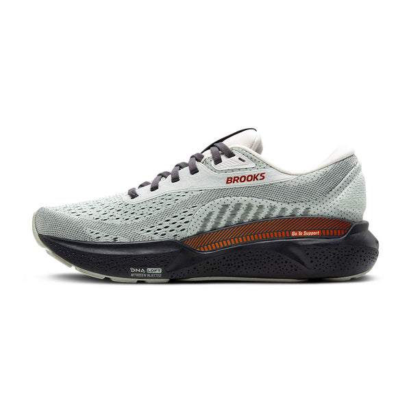 Orange stripes run across the top of the midsole on the medial side to highlight the GuideRail system used. 