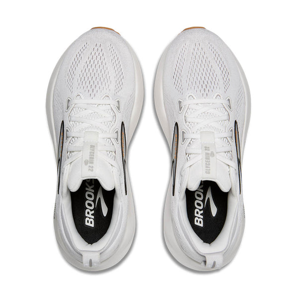 White running shoes with 'Brooks' branding on a white background.