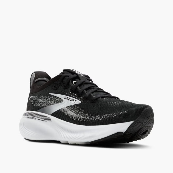 Black running shoe with white sole on a white background