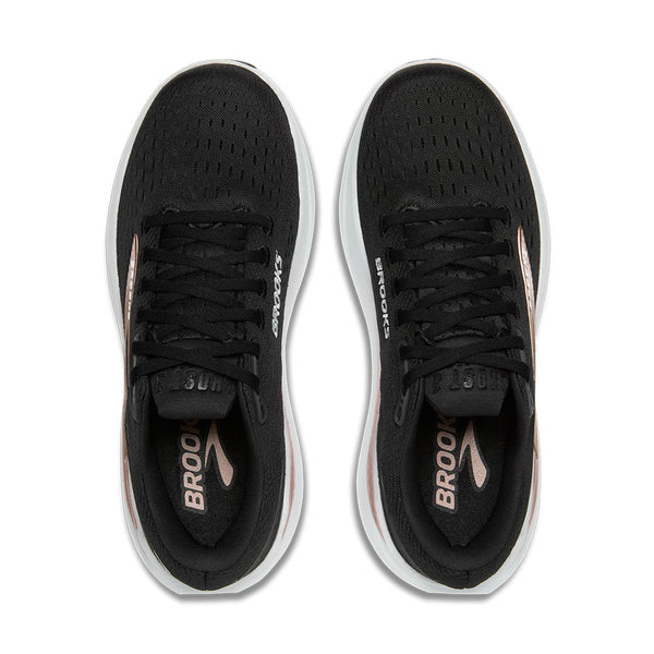 Black running shoes with white soles on a white background.