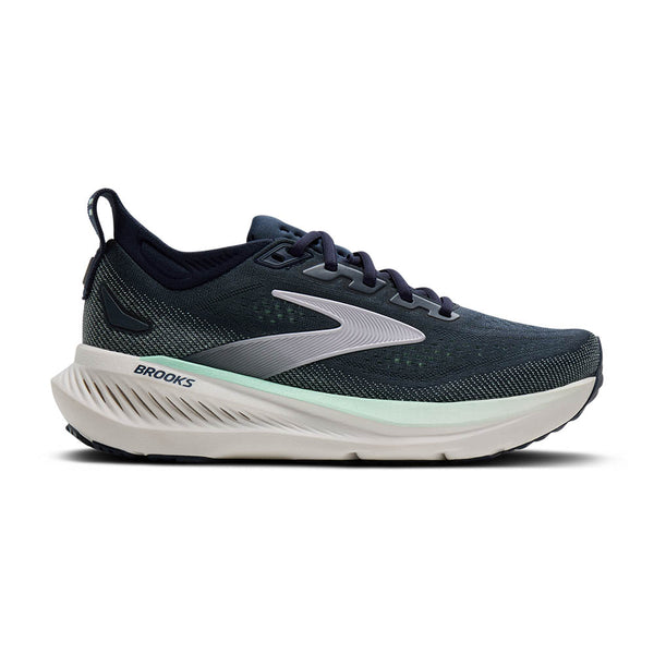 Navy running shoe with white sole on a white background