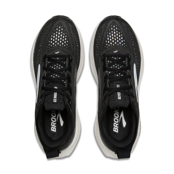 Black running shoes with white soles on a white background