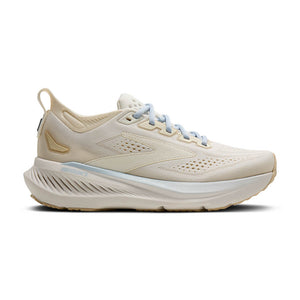 Beige running shoe with white sole on a white background