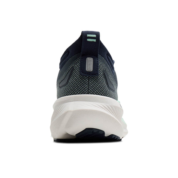 The heel of this Glycerin 23 for women is mostly navy and has a tab.