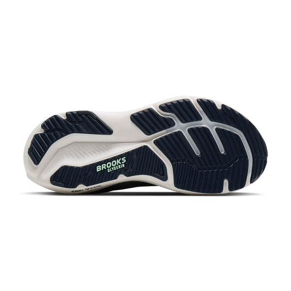 Navy and white running shoe sole with 'Brooks' branding on a white background