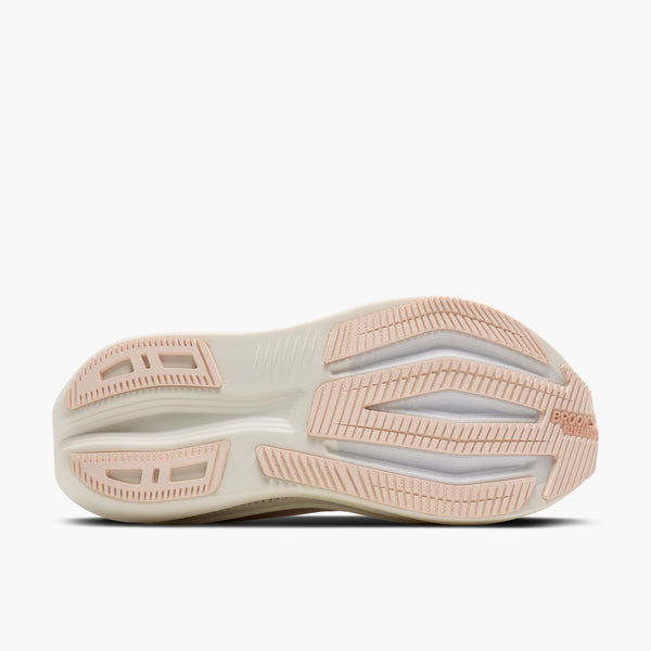 The outsole view of a Nike running shoe, showing a thick, cushioned white midsole and a light pink textured rubber outsole with the Nike logo and 'SonicBoost' branding.