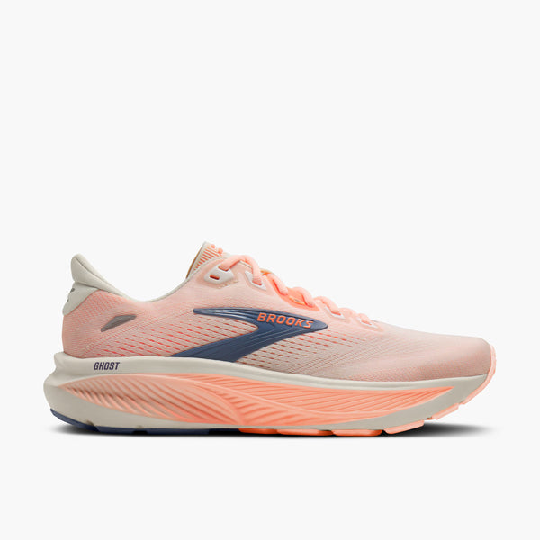 Light melon colored women's running shoe with 'Brooks' branding on a white background