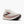 White running shoe with pink accents on a white background