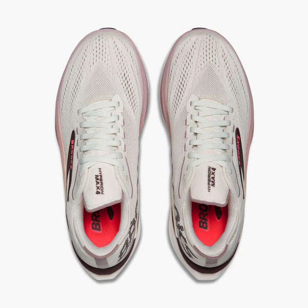 A pair of Brooks running shoes shown from a top-down view, featuring a white mesh upper with light pink accents, white laces, and a bright pink inner lining.