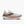 White running shoe with pink accents on a white background