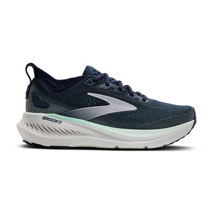 Navy running shoe with white sole on a white background