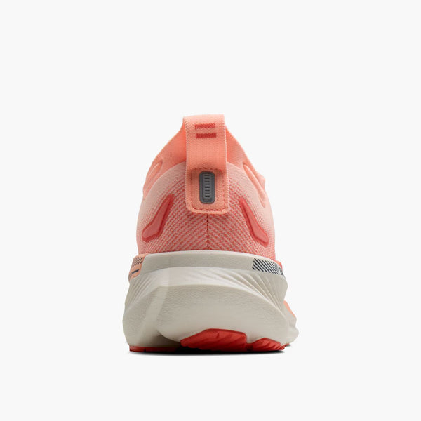 Back view of a pink and red running shoe on a white background