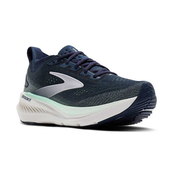 Navy running shoe with white sole on a white background
