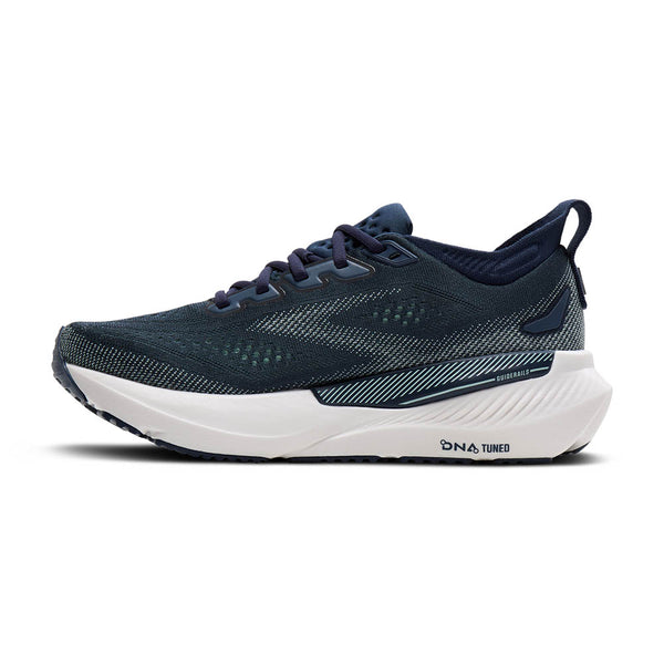 Navy running shoe with white sole on a white background
