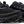 Black athletic shoes inpired casual shoes with visible brand logo on a white background.
