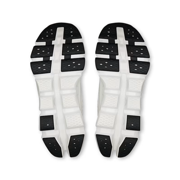 Pair of white and black athletic shoe inserts on a white background