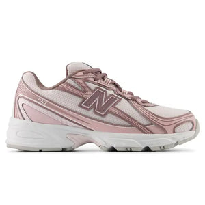 A New Balance athletic sneaker in dusty pink and white, shown against a plain white background.