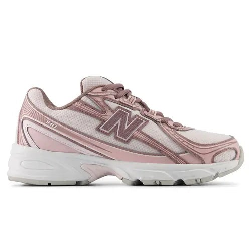 A New Balance athletic sneaker in dusty pink and white, shown against a plain white background.