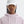 Person wearing a light pink hoodie and white cap on a plain background