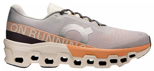 Gray running shoe with orange accents on a white background