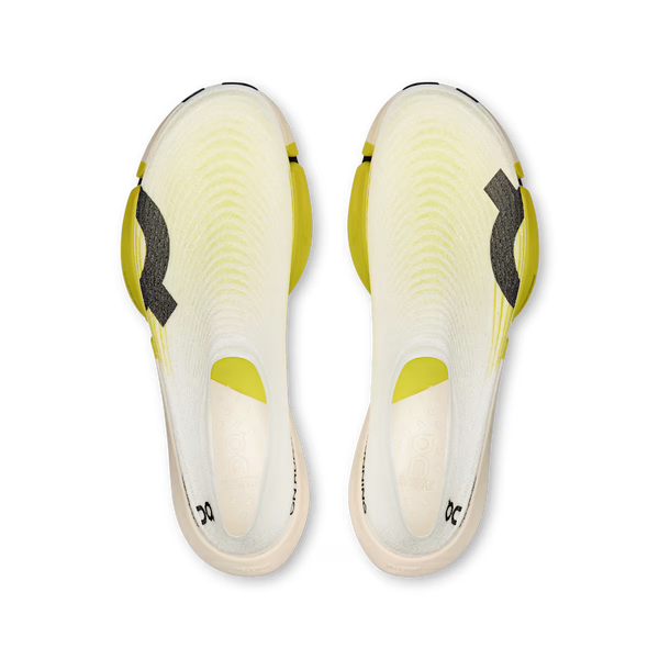 Top-down view of a pair of running shoes with a white and pale yellow knit upper, bright yellow accents, and black logo details on a white background.