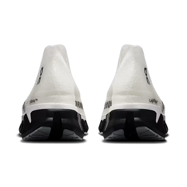 A pair of white and black running shoes shown from the back, featuring a textured white upper and a chunky black midsole and outsole, on a solid white background.