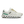 White running shoe with green sole on a white background
