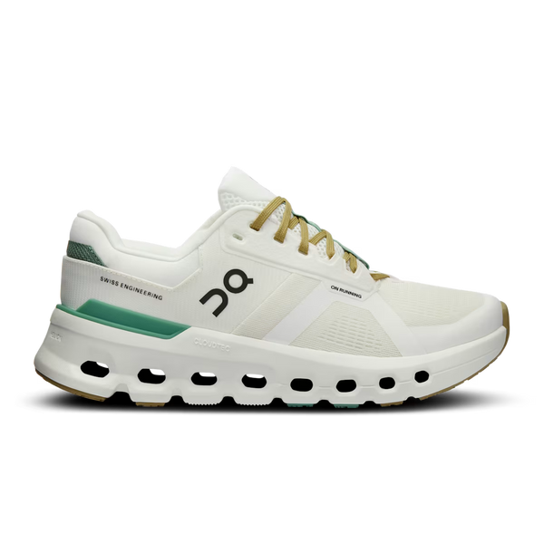 White running shoe with green sole on a white background