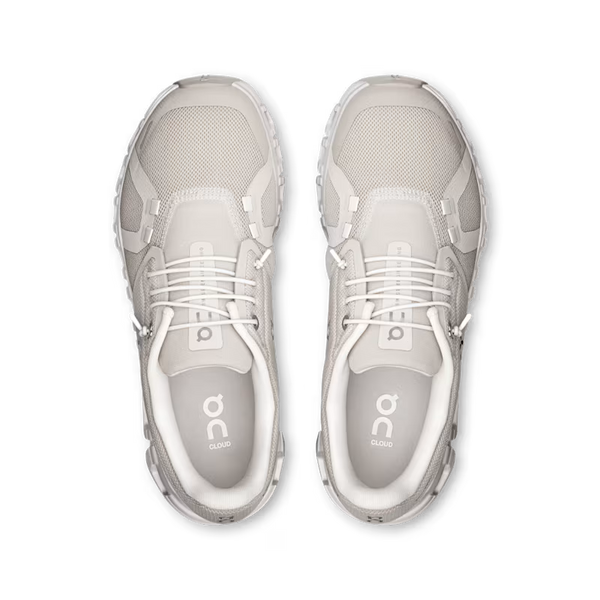 Pair of gray athletic shoes with 'on' branding on a white background