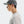Person wearing a gray cap and light gray shirt on a white background
