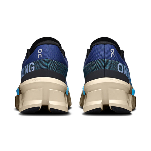 Back view of blue and black running shoes with 'On' branding on a white background.
