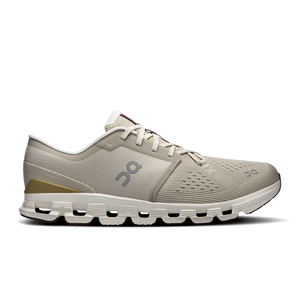 Gray running shoe with white sole on a white background