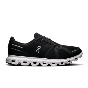 A pair of men's athletic shoes with a black upper and white sole.