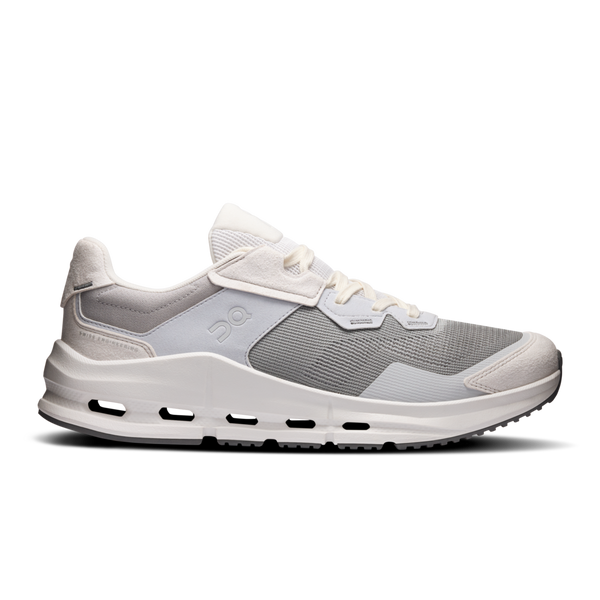 Gray athletic shoe with white sole on a white background