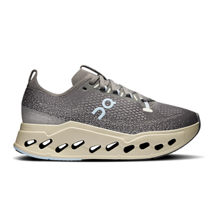 Gray running shoe with a unique sole design on a white background
