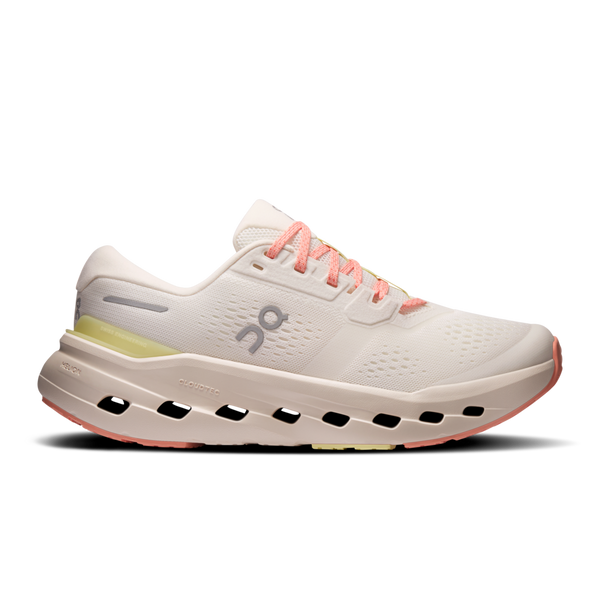 White running shoe with pink accents on a white background