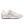 A New Balance low-top sneaker in off-white and beige suede with a metallic silver 'N' logo, a white midsole, and a brown gum outsole, shown in a side profile on a white background.